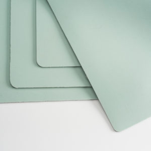Essentialware’s Green Silicone Rubber Heat Conductive Pads are used to help evenly distribute pressure and protect materials in the sublimation process.
